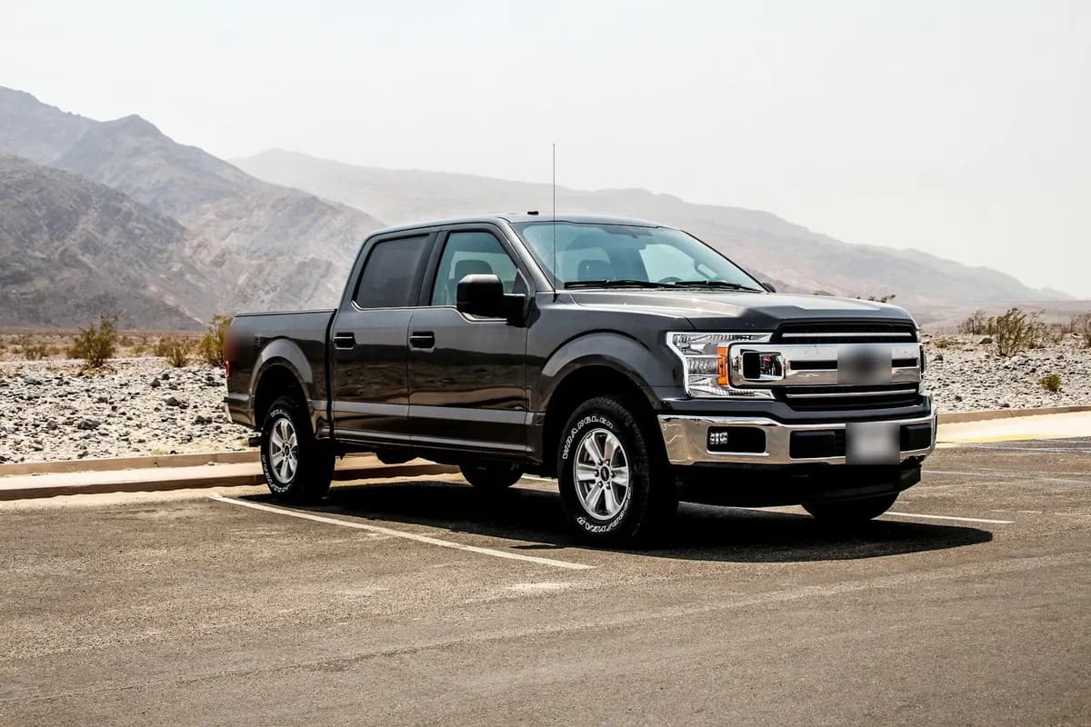 Pickup truck shipping: a stock full-size crew-cab pickup parked in a lot before transport